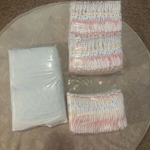 Pack of Baby Diapers Size One Huggies and LUVs